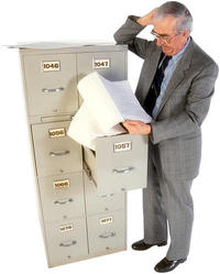 man working at file cabinet 12s.jpg